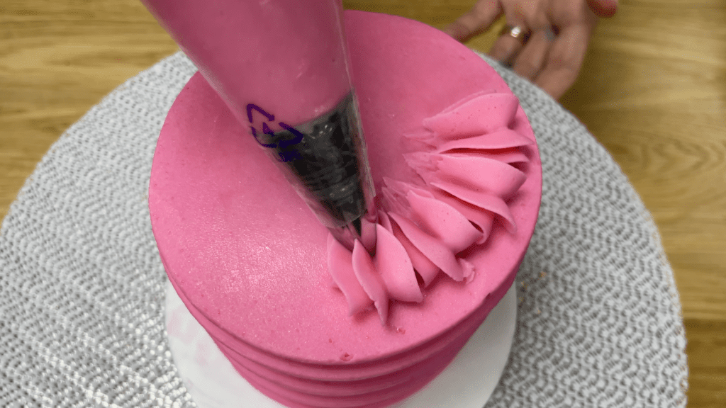 use piped frosting to attach cake toppers to a cake 5 Cakes You Can Decorate in 5 Minutes