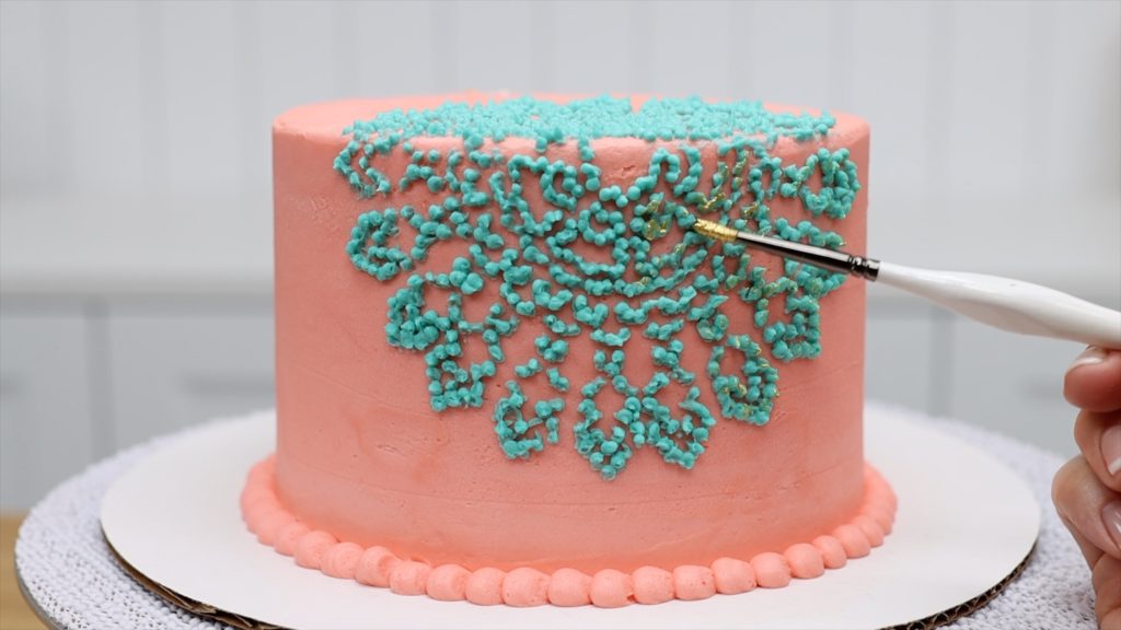 brush edible gold paint onto a cake after the frosting has set 10 ways to make your cakes look professional