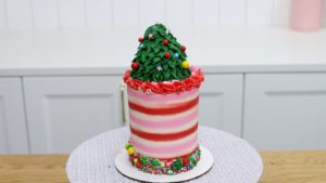 christmas tree cupcake cake topper on striped cake 5 Christmas Cake Decorating Ideas