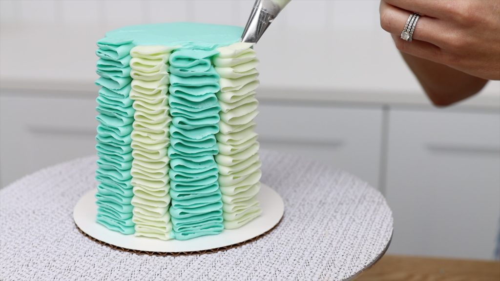 finish piping each stripe in the same direction 5 Striped Cake Hacks