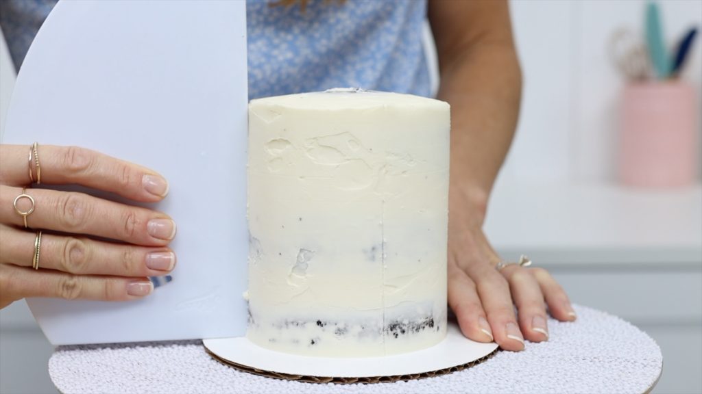 imprint stripe divisions on crumb coat frosted cake before piping 5 Striped Cake Hacks