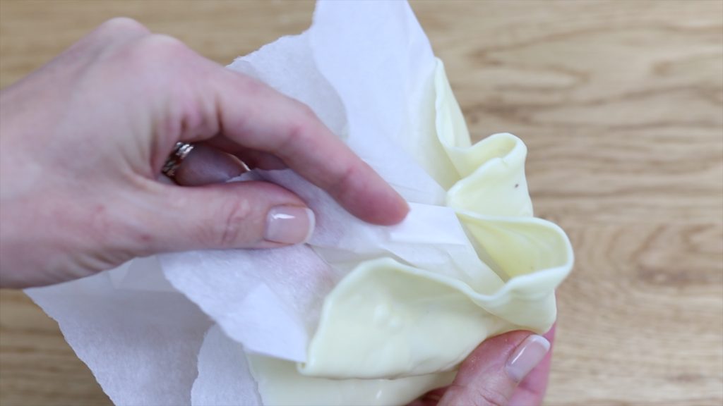 peel parchment away from chocolate basket or sail 4 Stunning Homemade Cake Toppers