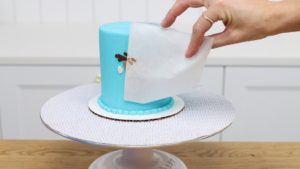 peel parchment off buttercream transfer on cake 5 Christmas Cake Decorating Ideas