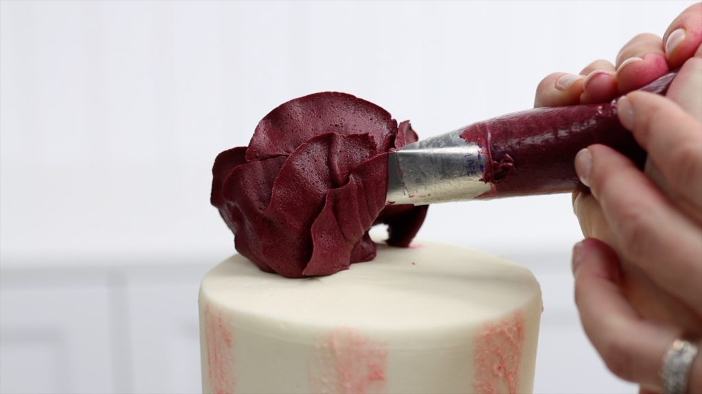 pipe more petals after attaching the rose to the cake 4 Stunning Homemade Cake Toppers