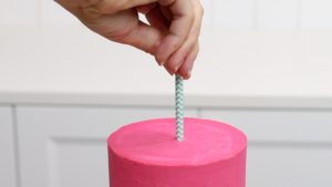 push paper straw into cake to attach cake topper 5 Christmas Cake Decorating Ideas