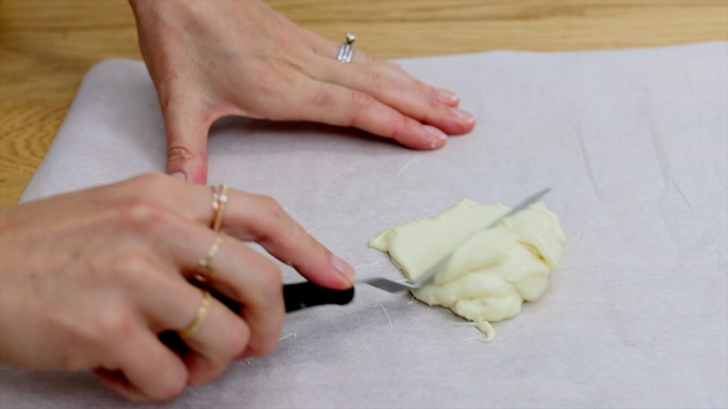 spread melted chocolate over parchment paper to make a cake topper basket or sail 4 Stunning Homemade Cake Toppers