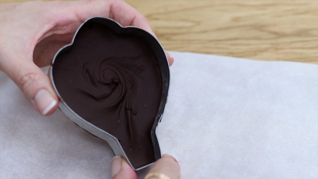 turn cookie cutter upside down to push chocolate out 4 Stunning Homemade Cake Toppers