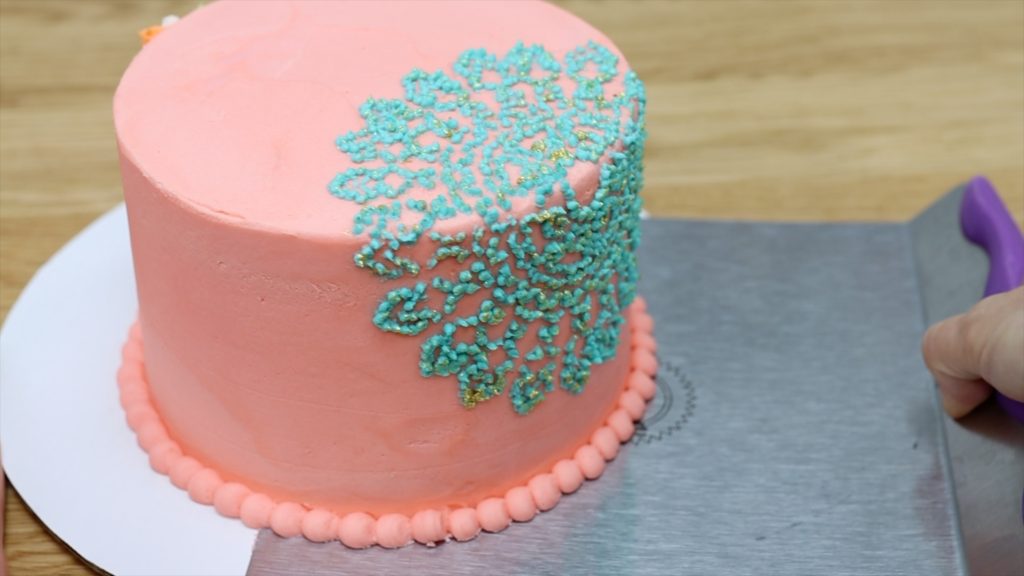 use a cake lifter to transfer a cake from a cake board to a cake stand 10 ways to make your cakes look professional