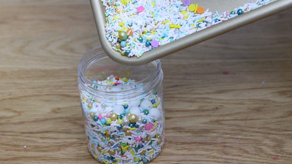 tip sprinkles from tray into sprinkle jar 11 BAKERY SECRETS for Cake Decorating