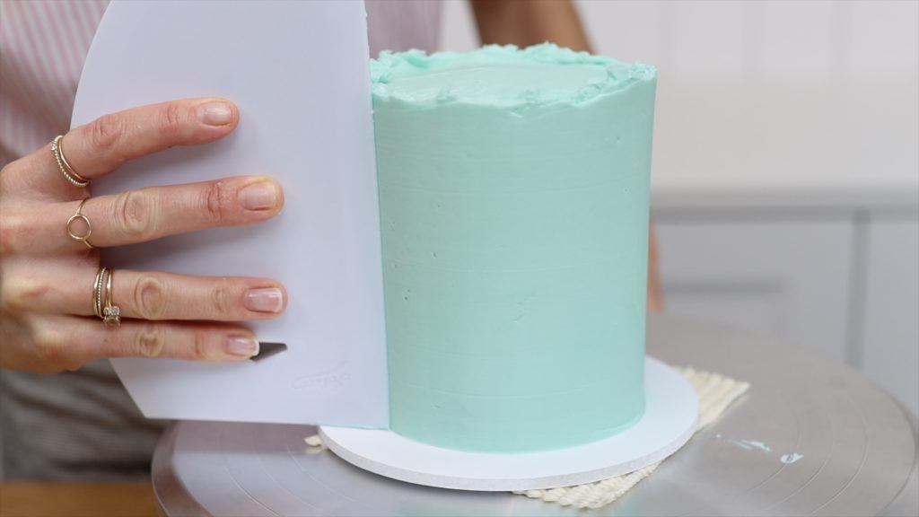 be patient and do touch ups and scrape several times with a cake comb to get smooth frosting on cakes 15 Frosting Mistakes You're Making