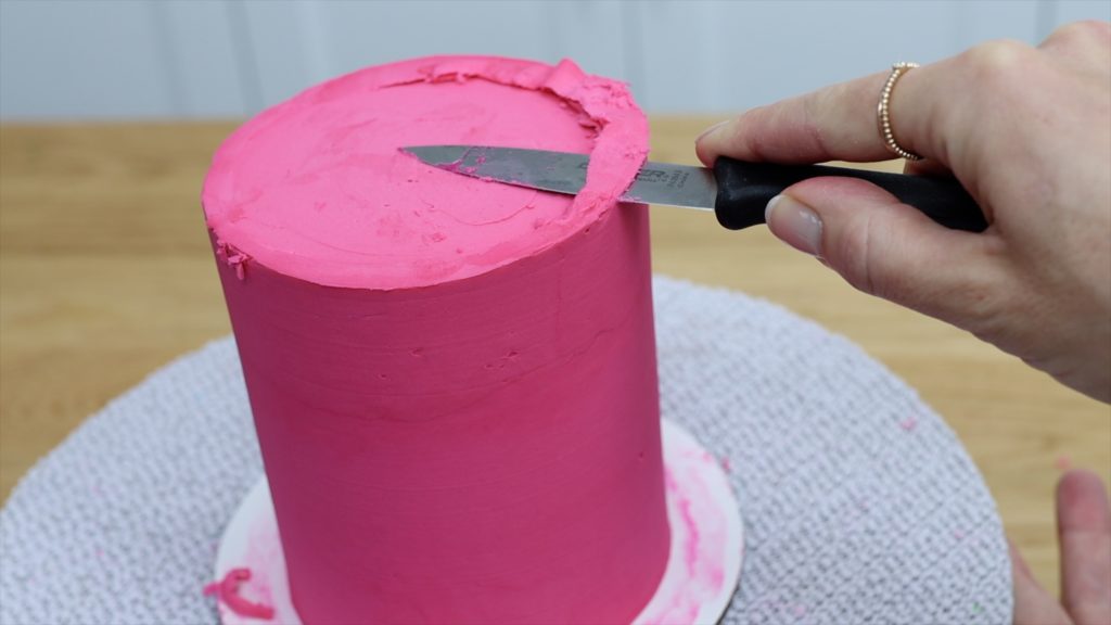 cut the frosting with a knife until it's flat and smooth How To Get Sharp Frosting Edges With A Knife