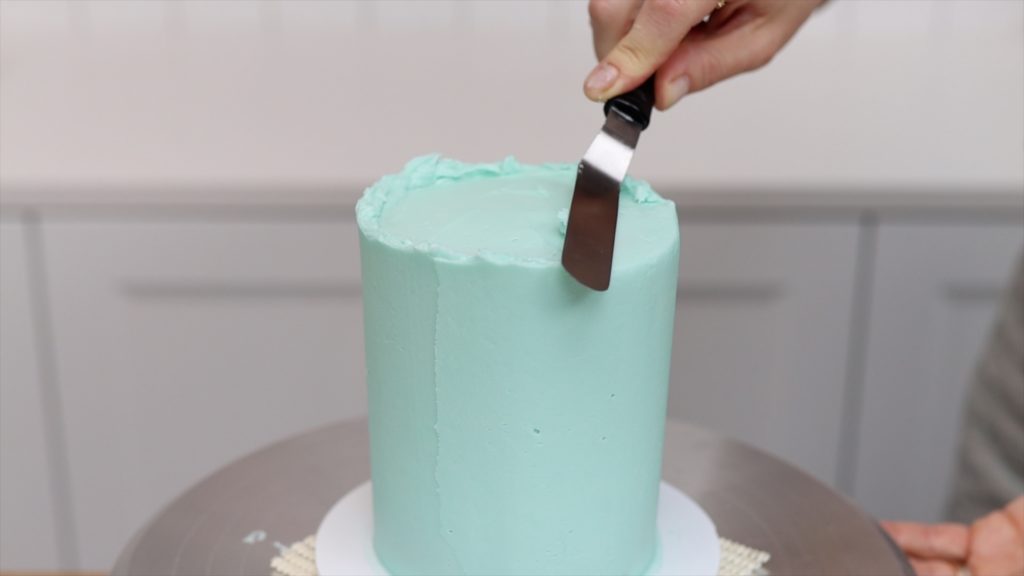 push sideways with your offset spatula to avoid bulges and get neat edges on your cakes 15 Frosting Mistakes You're Making