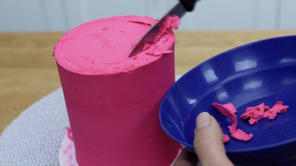 scrape frosting chunks off cake into a bowl to reuseHow To Get Sharp Frosting Edges With A Knife