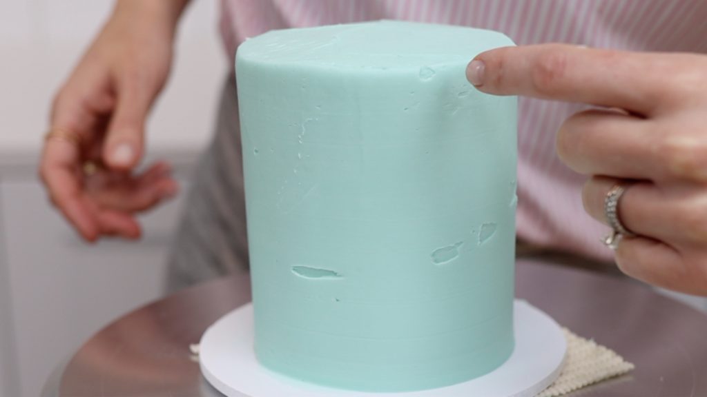 spread frosting up above top edge of cake to avoid these air pockets or indents or gaps around the top edge of the cake 15 Frosting Mistakes You're Making