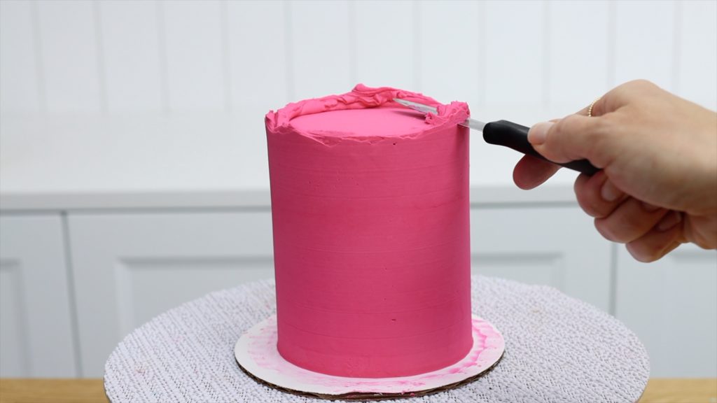 trim the frosting around the top edge of the cake with a sharp knife How To Get Sharp Frosting Edges With A Knife