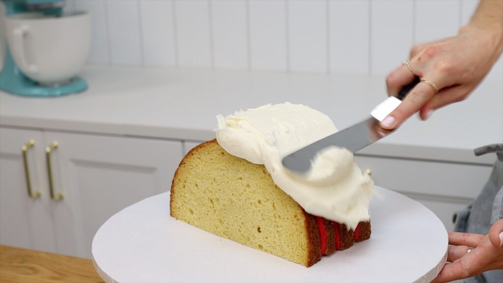 How To cover a Rainbow Cake with a crumb coat | British Girl Bakes