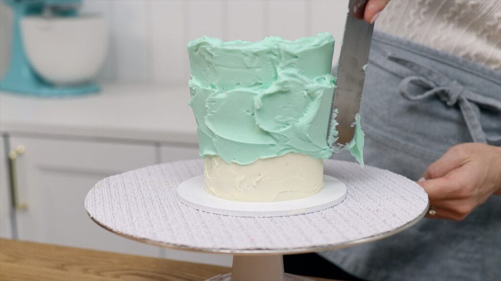 How to Fix a Leaning Cake by making the sides straight with more frosting | British Girl Bakes