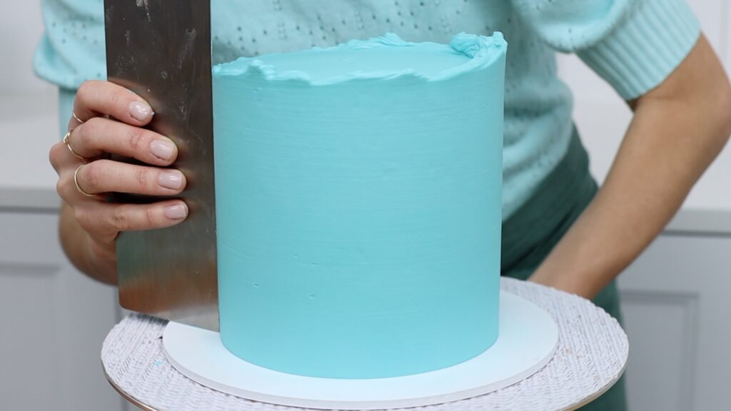 cover broken cake layers with frosting to decorate a cake | british girl bakes