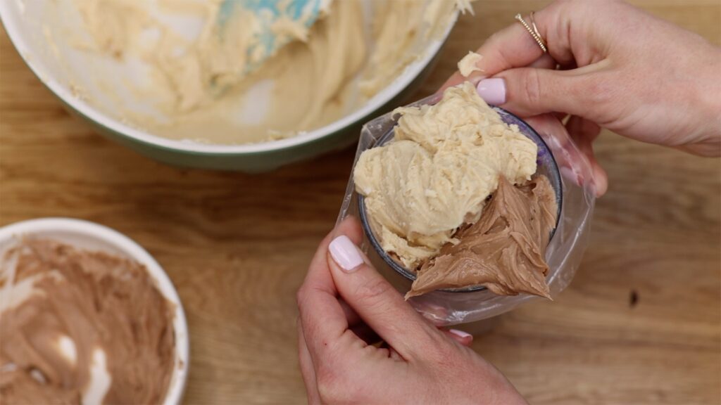 fill piping bag with two flavours of buttercream for two tone swirls on Chocolate Peanut Butter Cake | British Girl Bakes