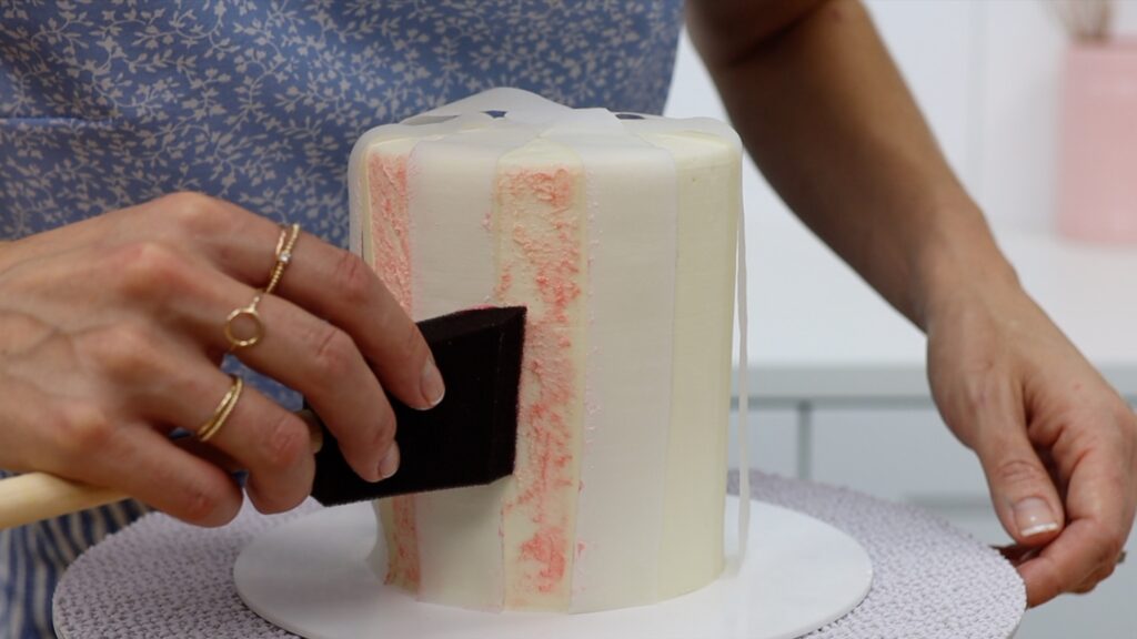 https://www.britishgirlbakes.com/wp-content/uploads/2022/02/how-to-paint-patterns-onto-a-cake-with-buttercream-sponge-painting-Parchment-Paper-Cake-Hacks-1024x576.jpg