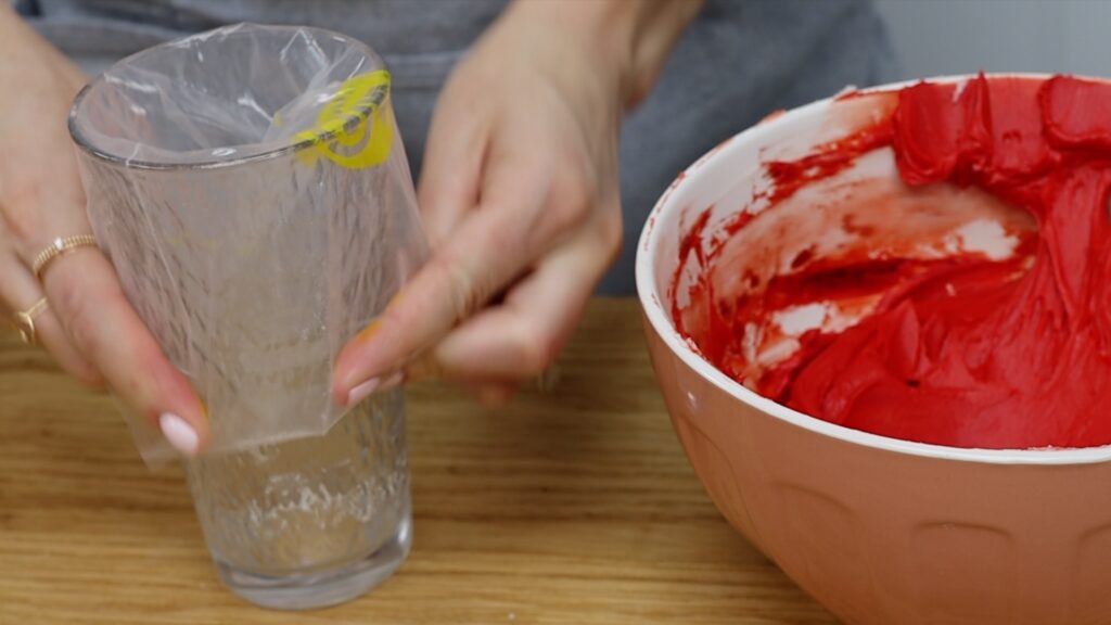 how to use a glass to fill piping bags neatly How To Make A Rainbow Cake | British Girl Bakes