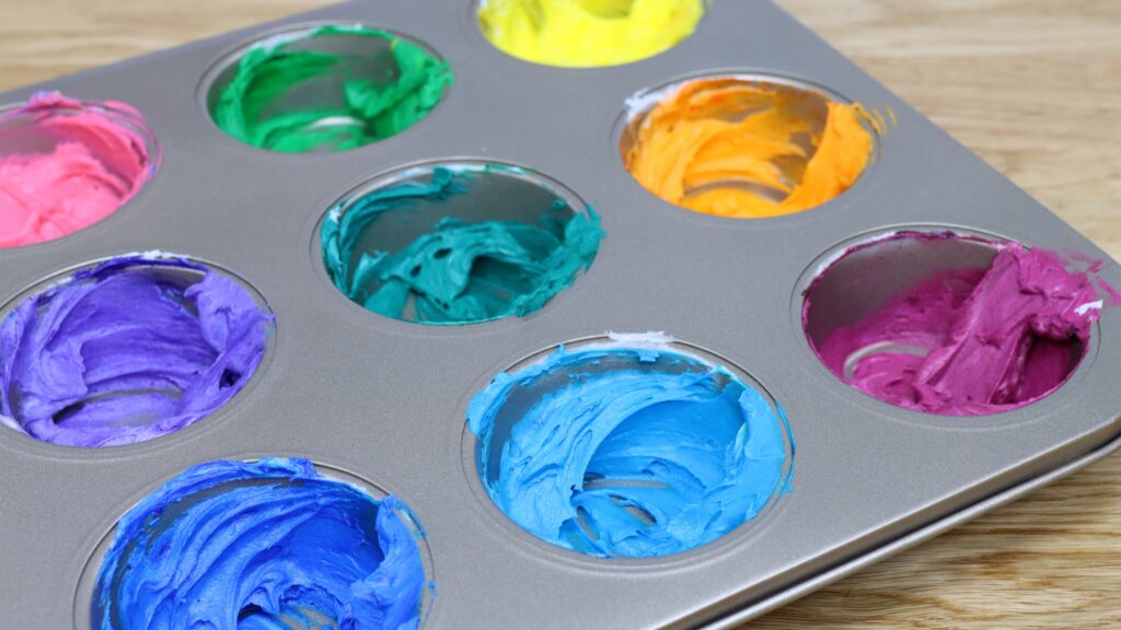 mix coloured frosting in cupcake pan for rainbow Homemade Stencil Cake - 5 Minute Cake Decorating | British Girl Bakes