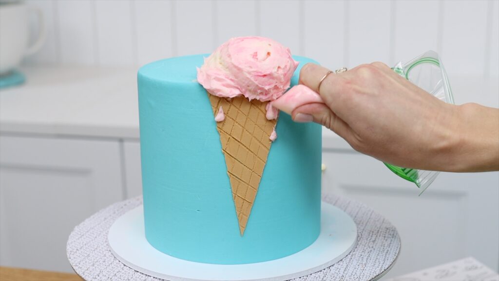 pipe buttercream drops to make ice cream look like it's melting How to Make an Ice Cream Cake | British Girl Bakes