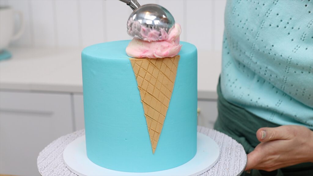 scoop buttercream on top of ice cream cone How to Make an Ice Cream Cake | British Girl Bakes