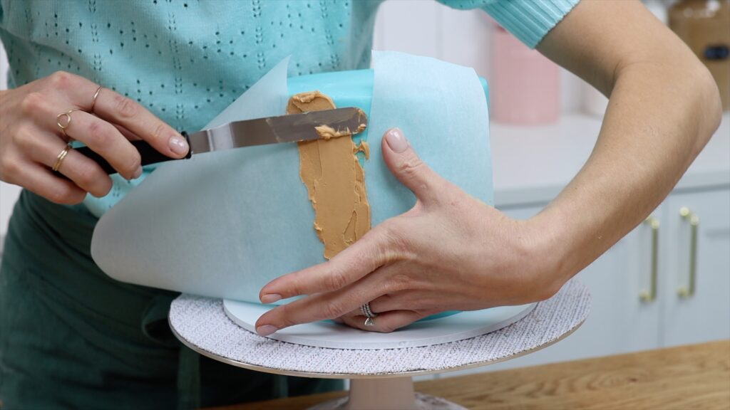 spread broen frosting over ice cream cone stencil How to Make an Ice Cream Cake