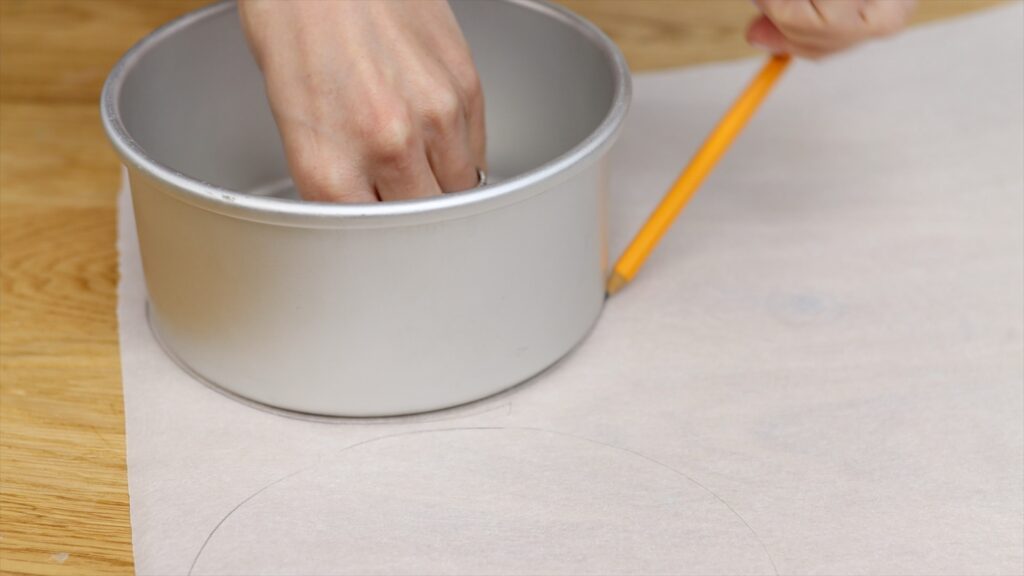 trace around pans onto parchment paper to make non stick parchment liners for cake pans | british girl bakes