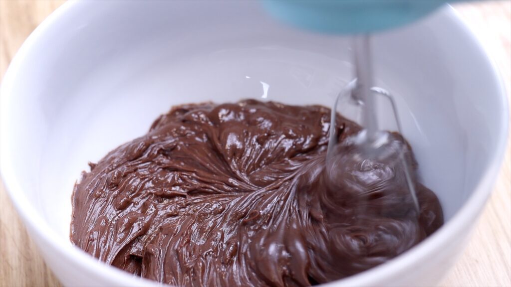 whip chocolate ganache to make ganache filling or frosting for 4 desserts