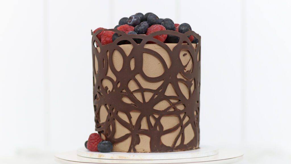 chocolate collar cake with berries on top