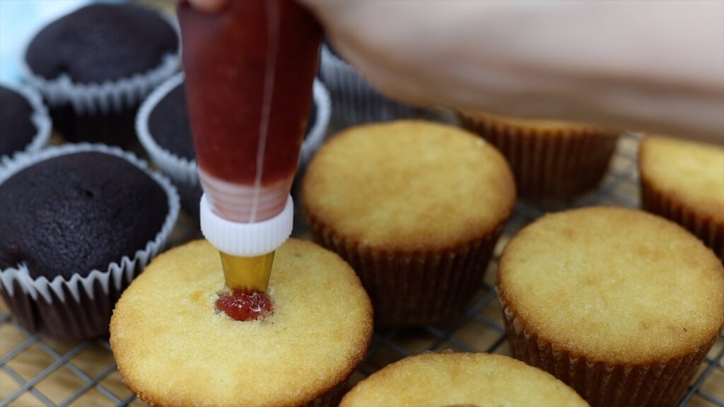 how to fill cupcakes with piping bags with 6 easy fillings strawberry jelly jam