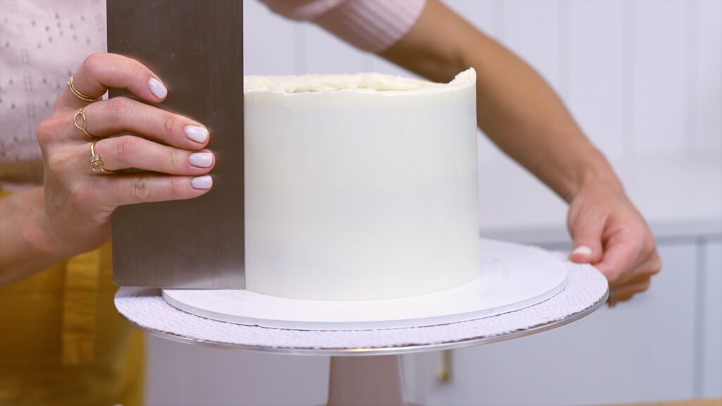 piping frosting onto cakes reduces crumbs 15 PIping Hacks for Cake Decorating