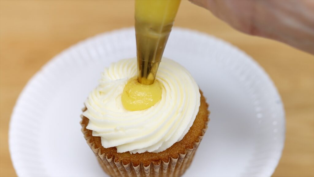 to to frost and decorate filled cupcakes with a piping bag