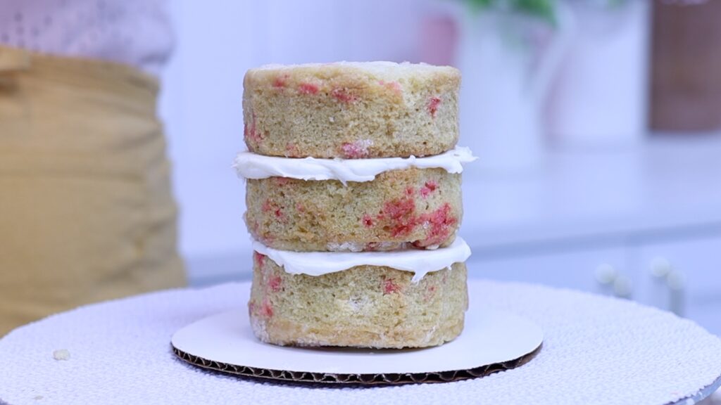 add rainbow sprinkles to make an Easy Rainbow Cake