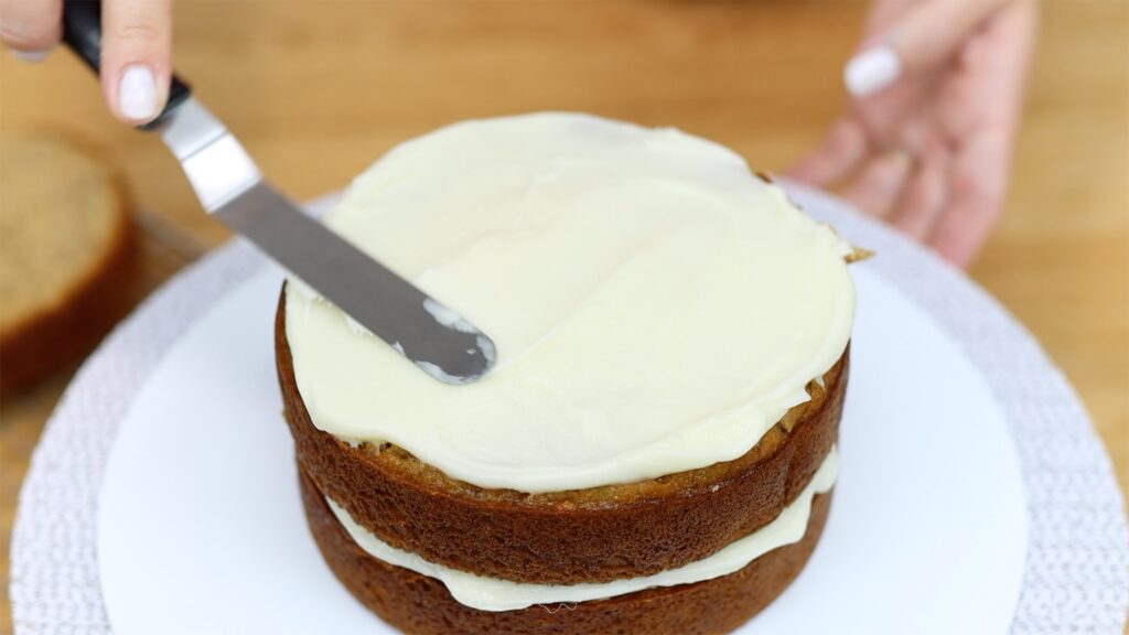 cream cheese frosting filling on banana cake