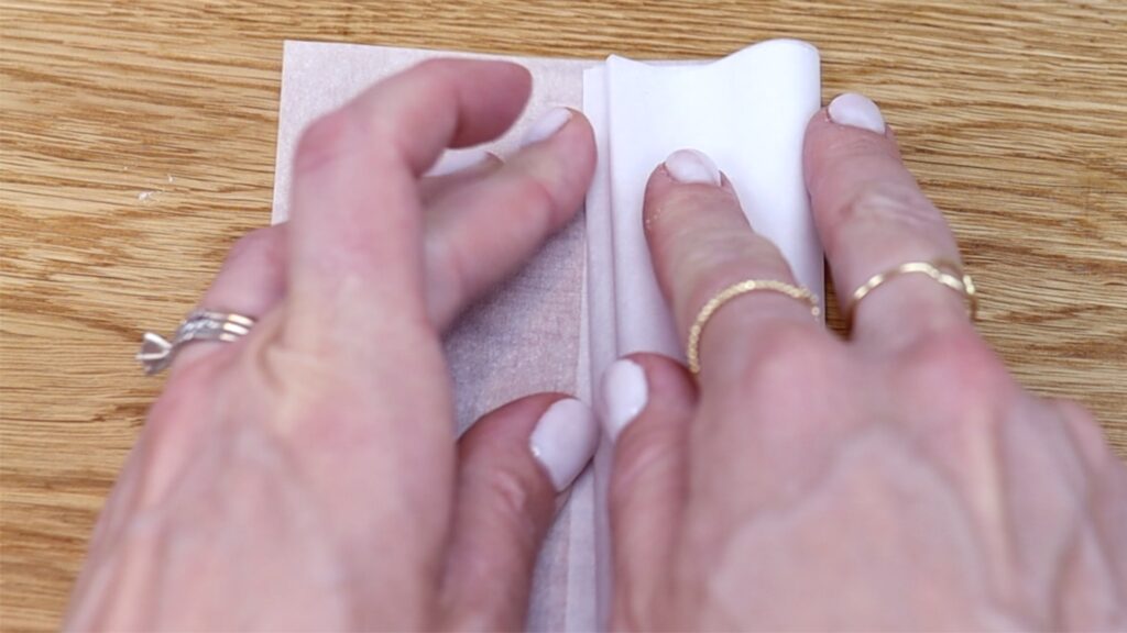 fold parchment paper to make a symmetrical stencil