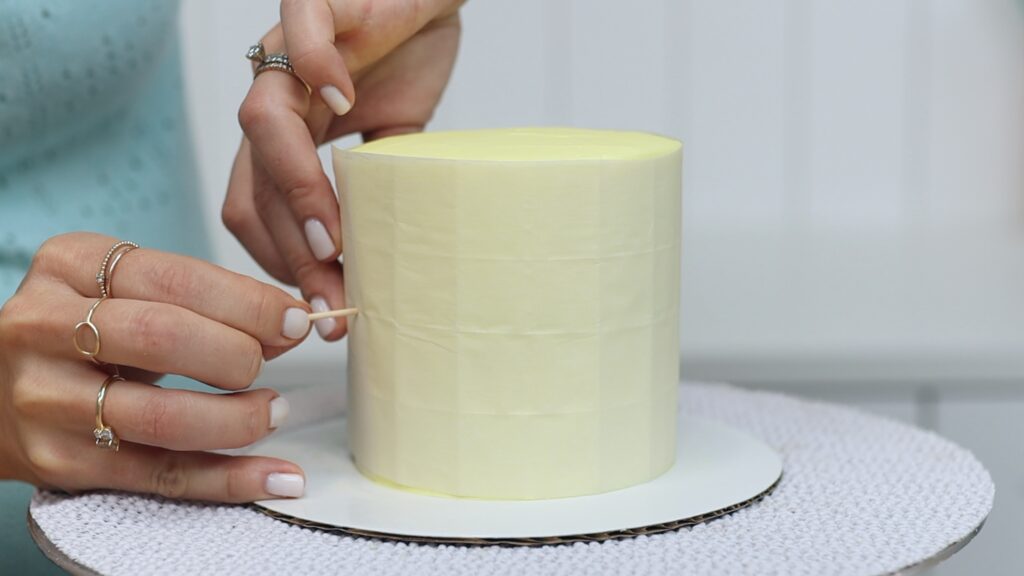 how to attach a parchment paper stencil to a cake