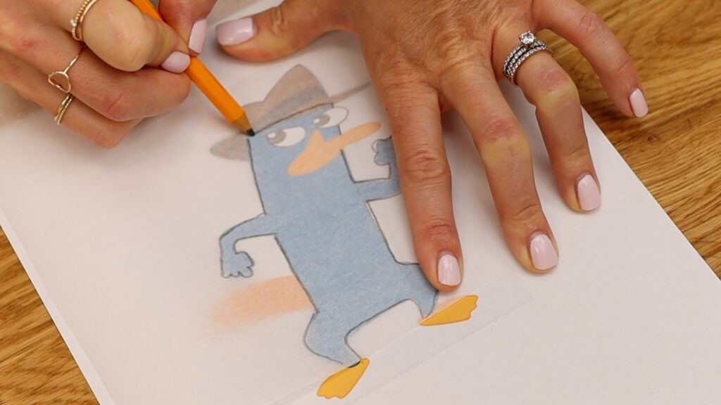 how to make a character on a cake with parchment paper