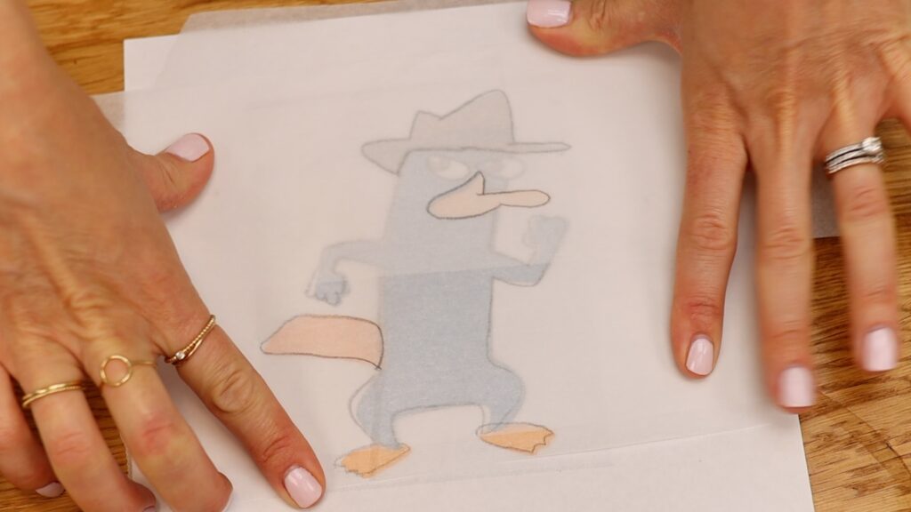 how to make a character on a cake with parchment paper stencils