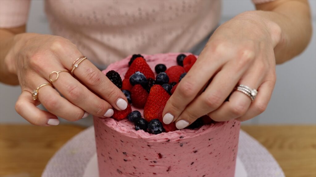 how to stick berries to a cake