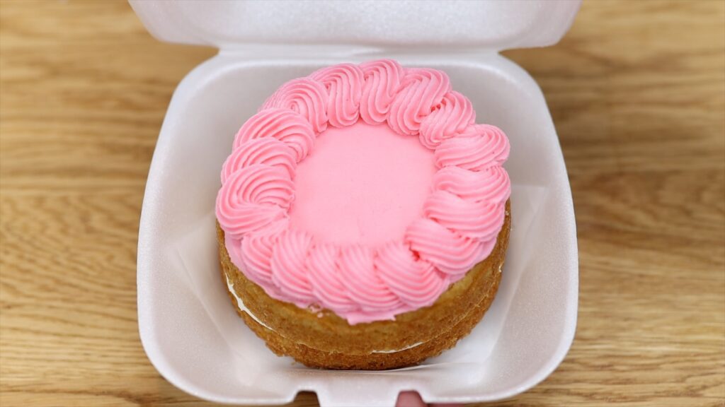 pink lunchbox cake with piped frosting