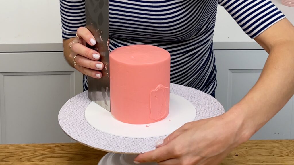 poked finger into frosting on cake