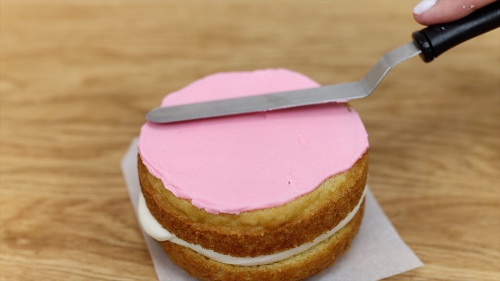 spread frosting onto lunchbox cake