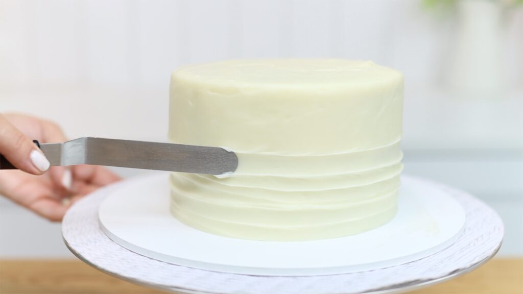 textured cream cheese frosting on banana cake