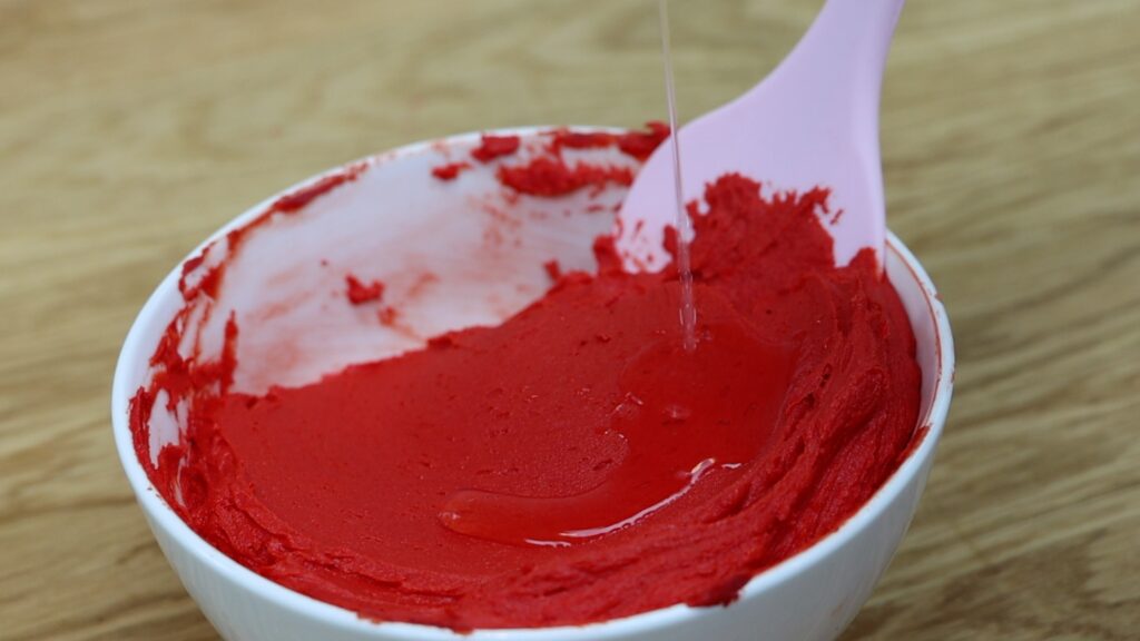 add vanilla flavor to take away bitter taste of red gel color