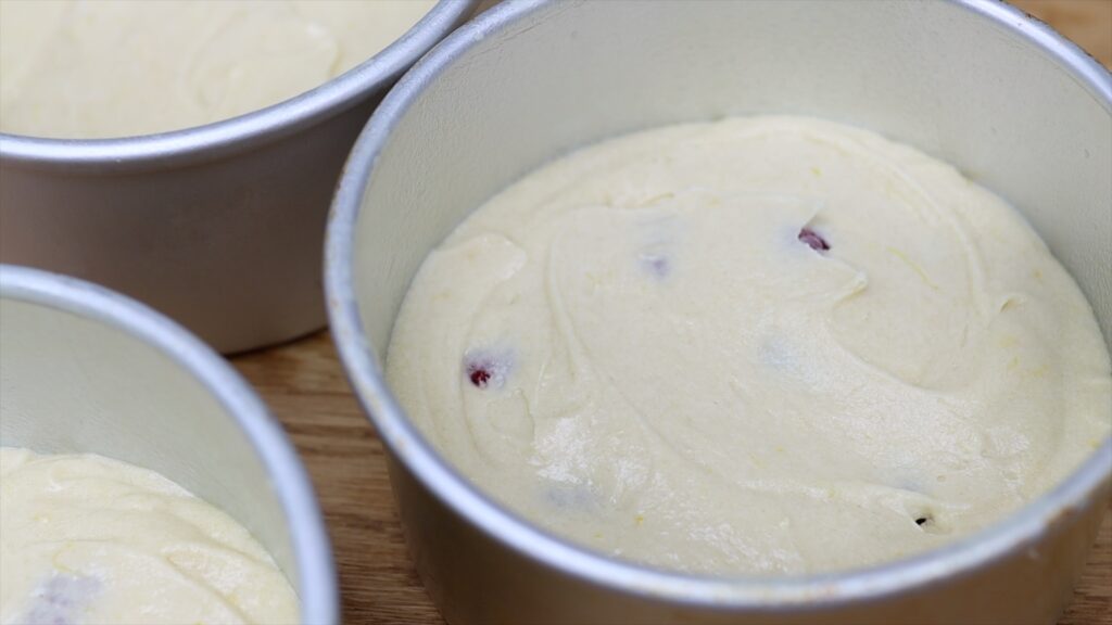 fold raspberries into cake batter