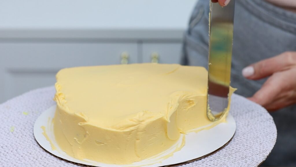 frosting a heart shaped cake