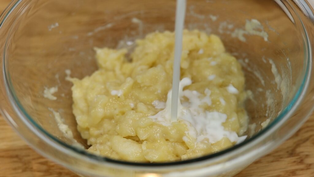 mix banana and milk for cake batter